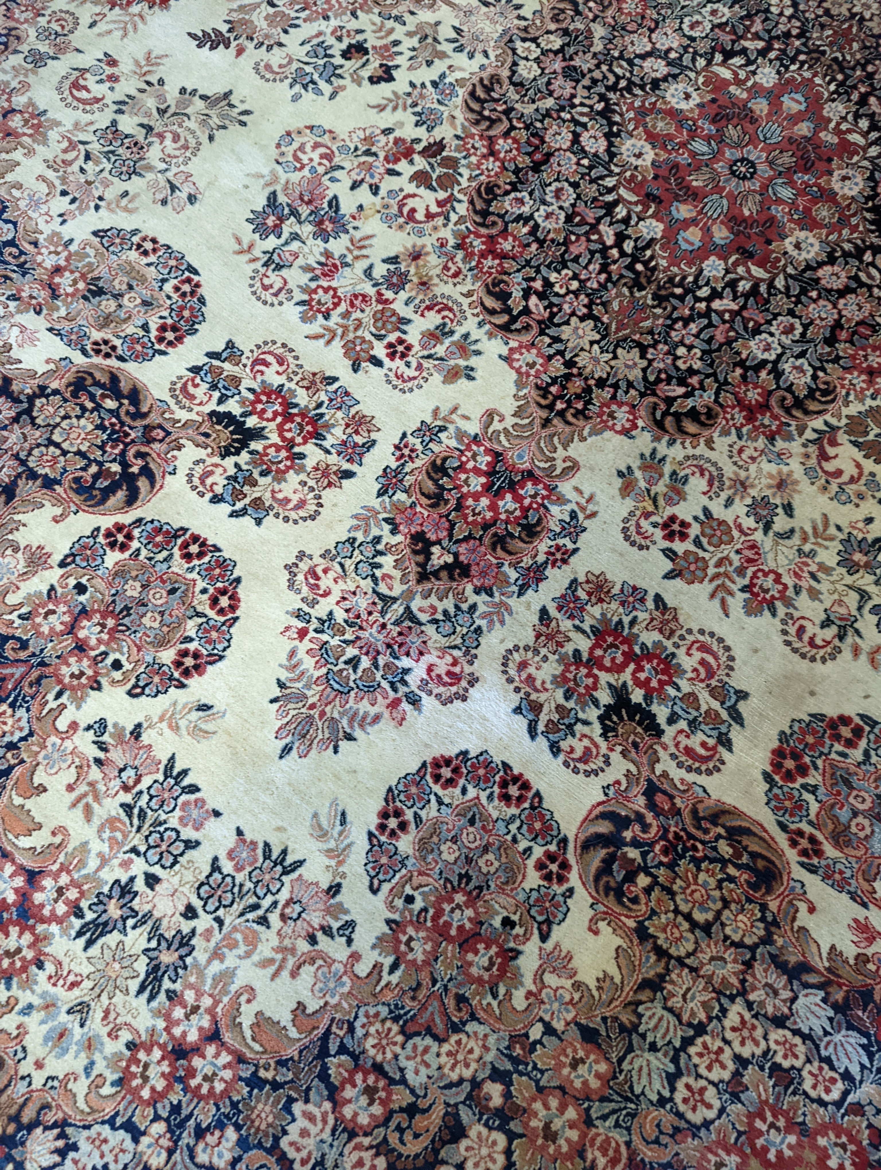 A North West Persian ivory ground carpet, 410 x 310cm